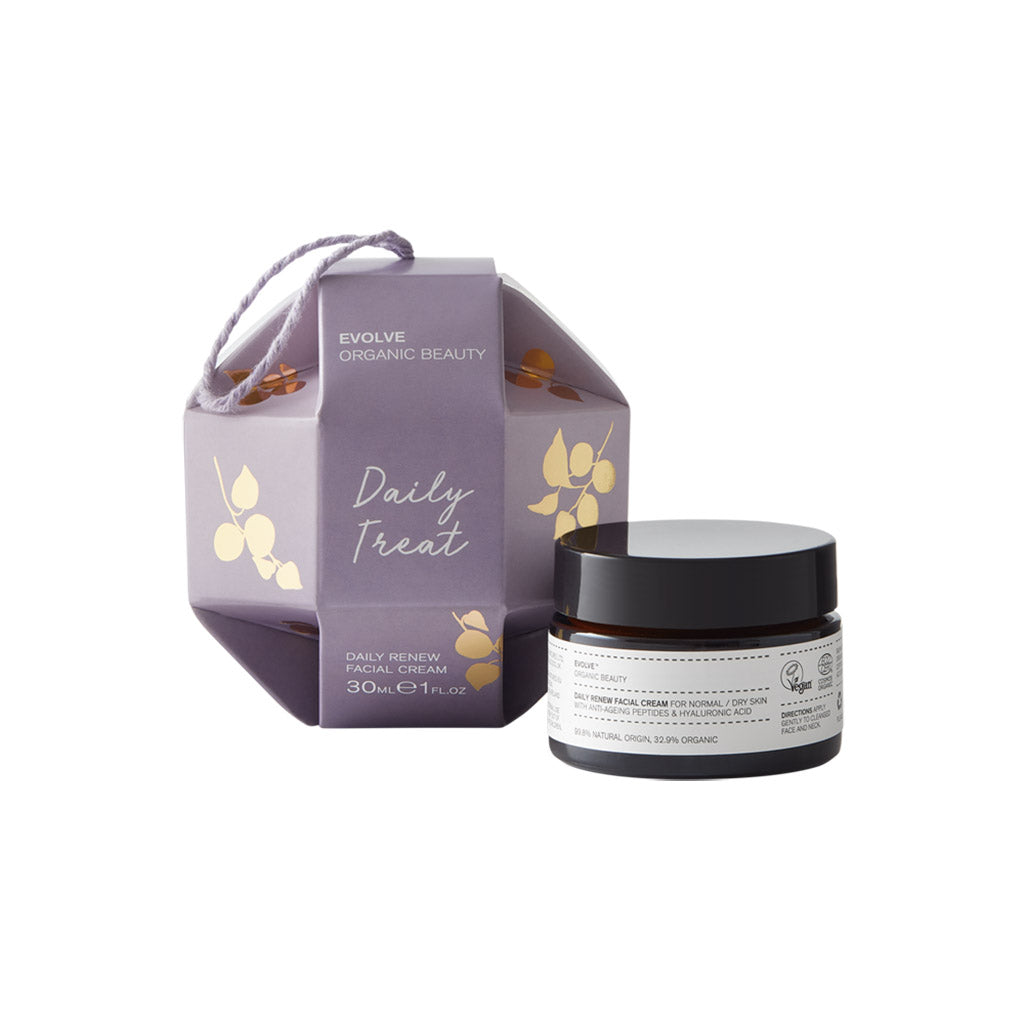 Daily Renew Cream in amber glass jar packaged in purple and gold bauble with a hanging loop from Evolve Organic Beauty