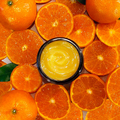 Miracle vitamin c mask with oranges and leaves background  evolve organic beauty
