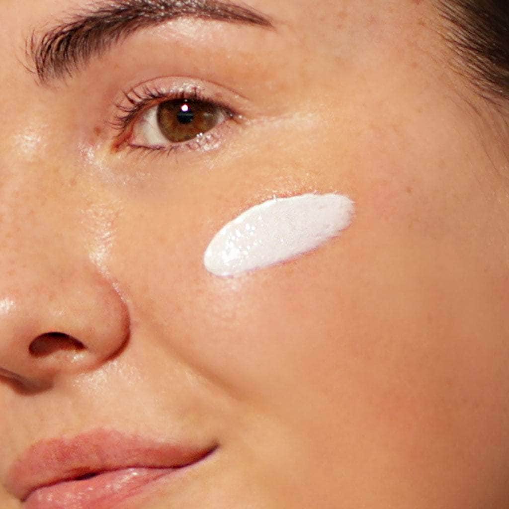 organic skincare model wearing spf 30 face cream