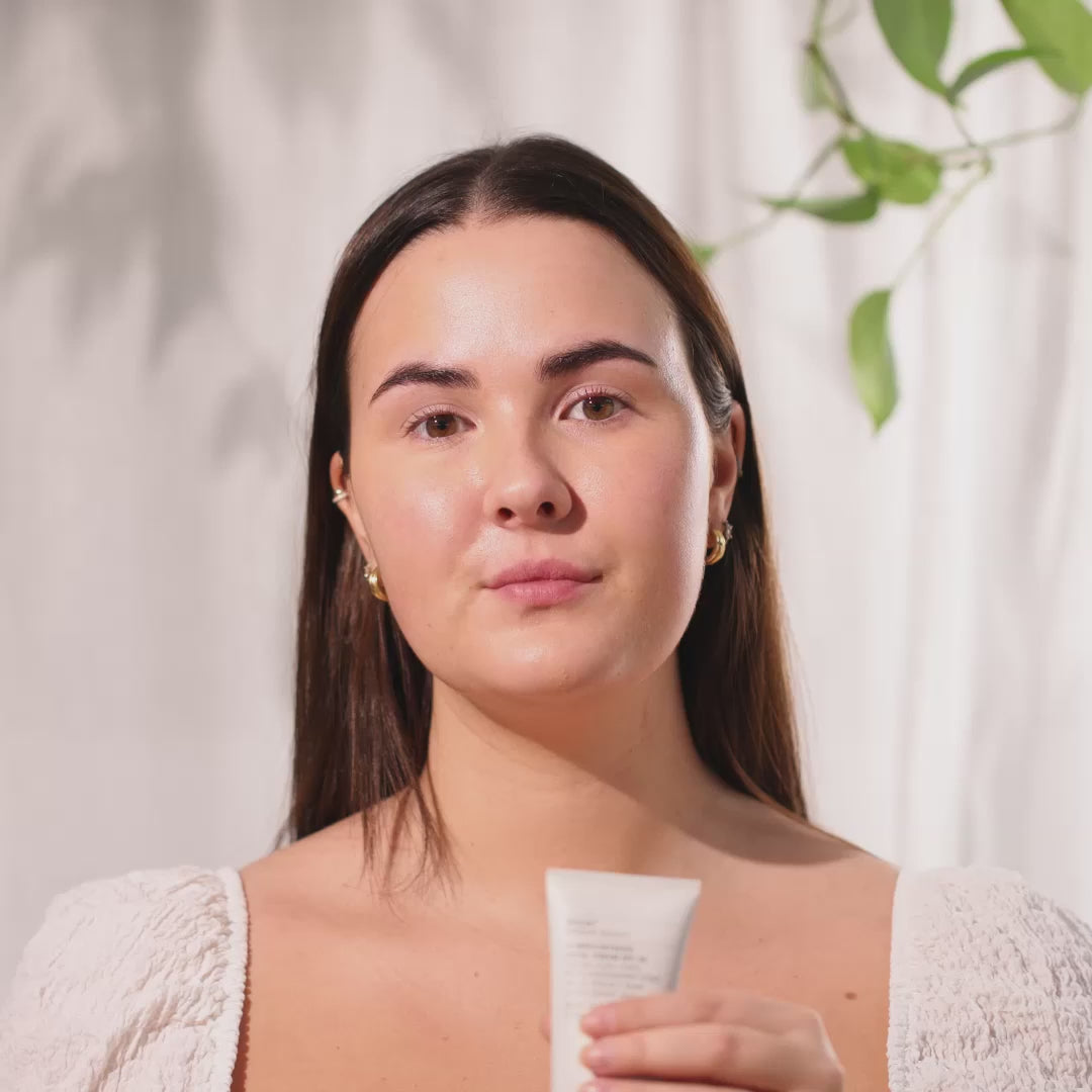 video of organic skincare model showing how to apply spf 30 face cream from evolve organic skincare