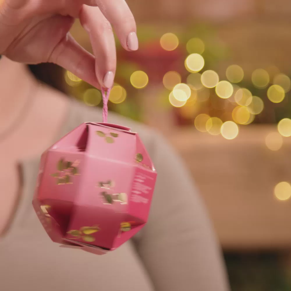 video showing skincare model displaying the Smooth Kiss  christmas gift bauble from evolve organic skincare