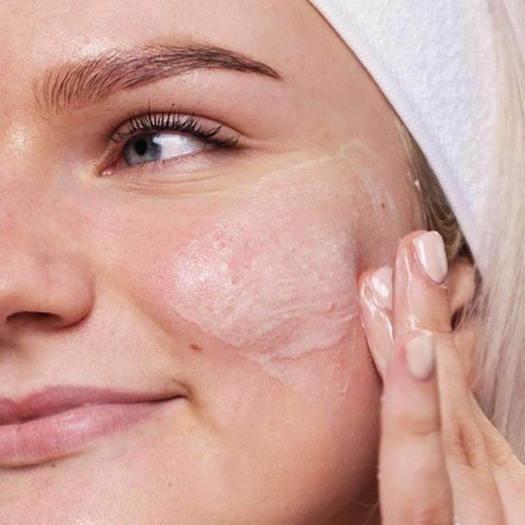 skincare model cleansing face with aloe face wash