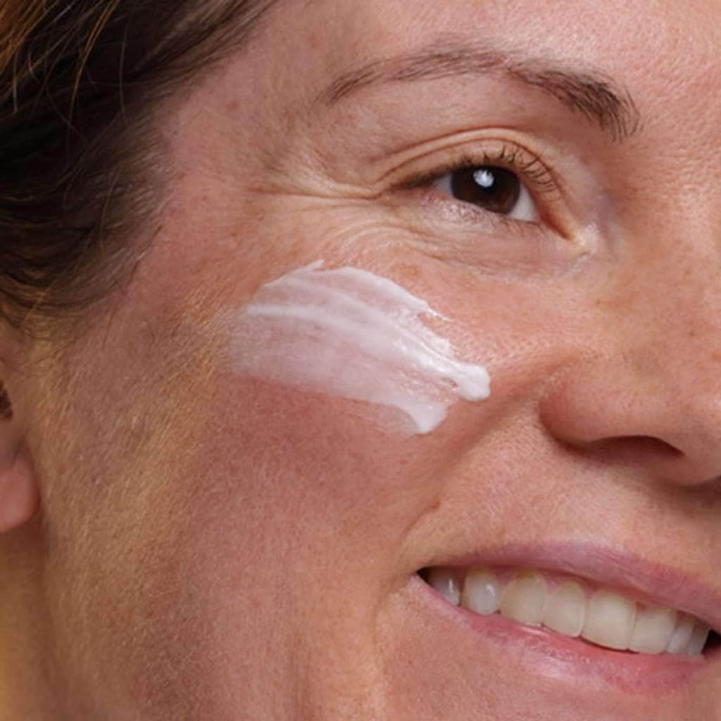 skincare model moisturising face with nightly renewal face cream organic night cream